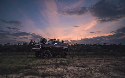 gray SUV on dirt thumbnail