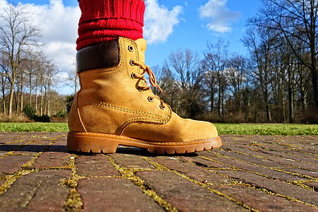 person wearing brown leather work boot thumbnail
