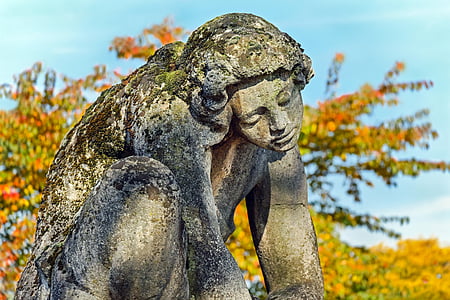woman statue near trees thumbnail