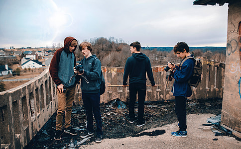 Young Photographers looking at Cameras thumbnail