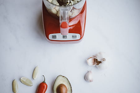 garlic and chili on white surface thumbnail