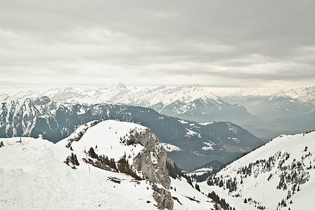 Aerial view of mountain range covered by snow thumbnail