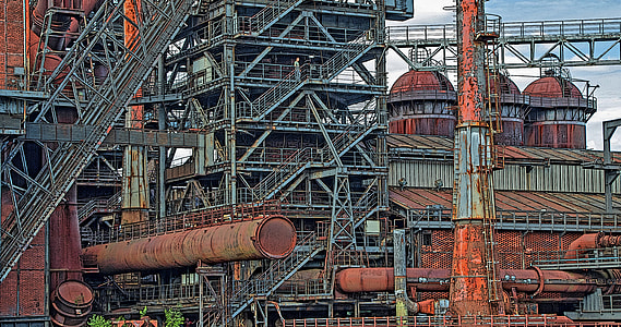 photograph of gray and brown metal structures thumbnail