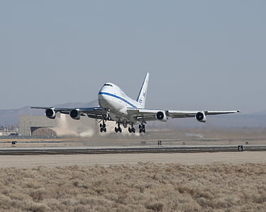 white airplane lifting off thumbnail