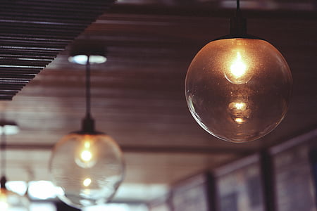 lit clear glass ball pendant lamp thumbnail