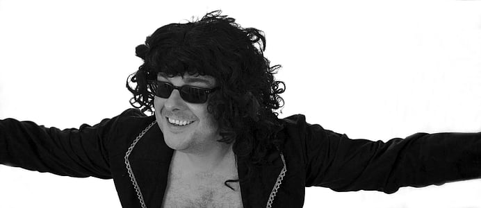 grayscale photography of man wearing blazer thumbnail