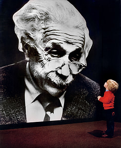 boy looking on Albert Enstein photo thumbnail