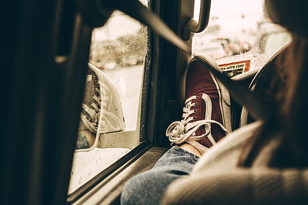 person showing red low-top sneaker thumbnail