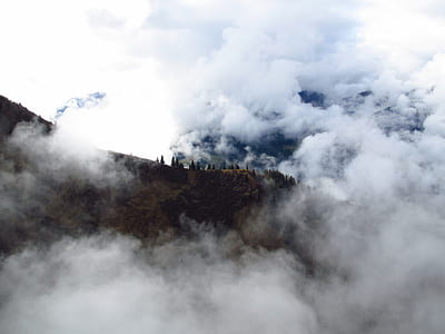 photo of mountains covered by clouds thumbnail