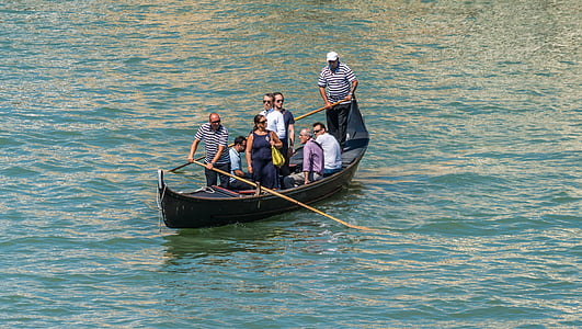 people on black boat on body of water at daytime thumbnail