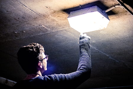 man fixing electric component thumbnail