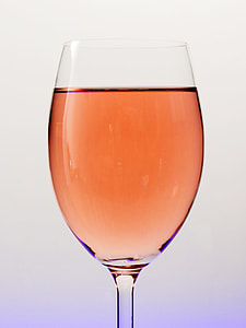wine glass filled with orange liquid thumbnail