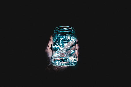person holding glass mason jar thumbnail