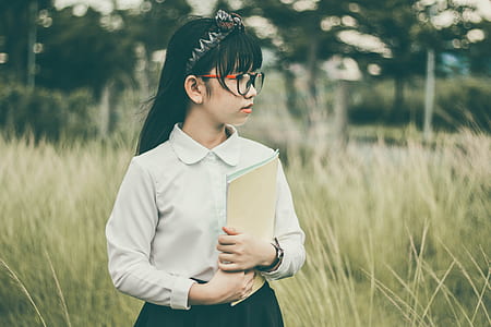 girl wearing white button-up uniform at daytime thumbnail