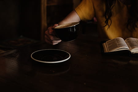 person holding black ceramic cup thumbnail