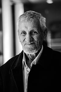 selective focus photography of grayscale man portrait thumbnail