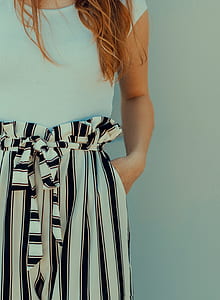woman wearing white cap-sleeved top and striped skirt thumbnail