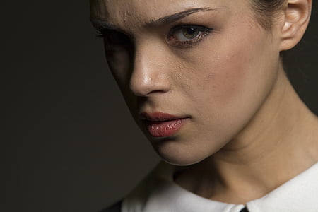 photo of woman wearing white and black top thumbnail
