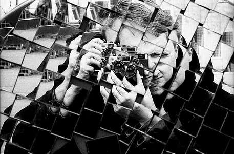 man holding camera thumbnail