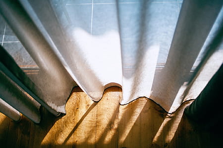 white curtain on brown wooden floor thumbnail