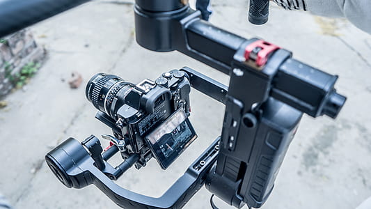 black DSLR camera with stabilizer thumbnail