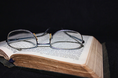 eyeglasses with silver frame on book page thumbnail