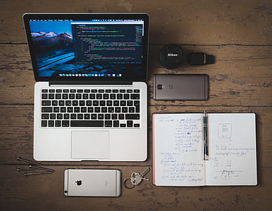MacBook with smartphones and notebooks thumbnail
