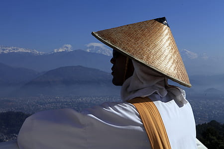 man warming up on top of mountain thumbnail