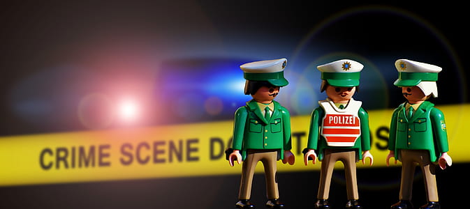 three police toys near crime scene barricade tape thumbnail