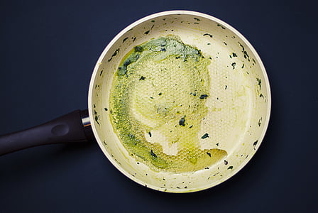 round white cast-iron skillet on black surface thumbnail