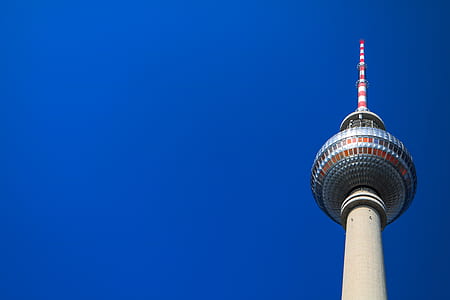 low-angle photography of tower under calm blue sky thumbnail
