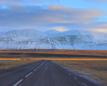 landscape photo of road and mountains during daytime thumbnail