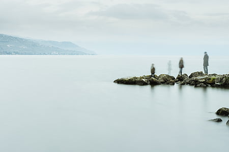 three person's near water body thumbnail