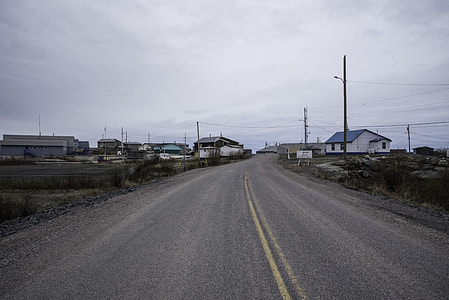 Road into Dettah under cloudy skies on the Ingraham Trail thumbnail