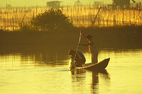 two person on boat near island thumbnail