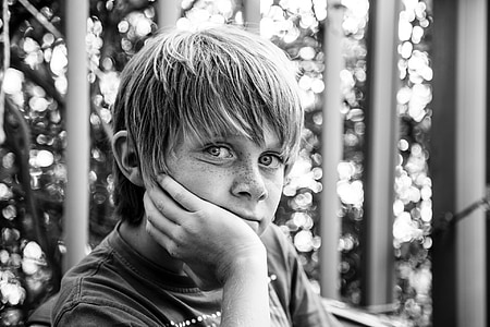 grayscale photo of boy wearing crew-neck top thumbnail
