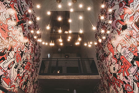 chandelier between mural walls thumbnail