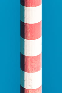 white and red post under blue sky thumbnail