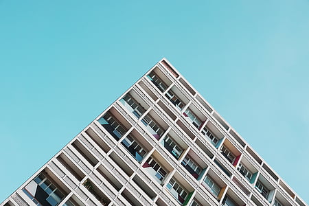 high-angle photography of brown concrete building under blue sky thumbnail