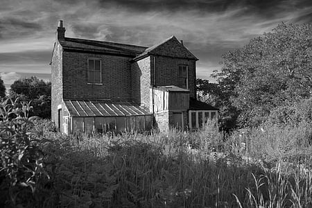 grayscale photography of brick house thumbnail