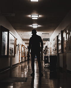 silhouette of man standing on hallway thumbnail