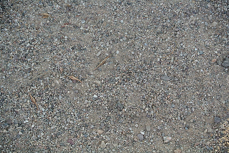 close-up photo of sand with stonse thumbnail