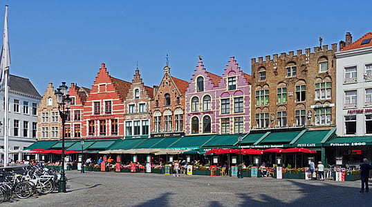 market near colorful establishment under blue sky thumbnail
