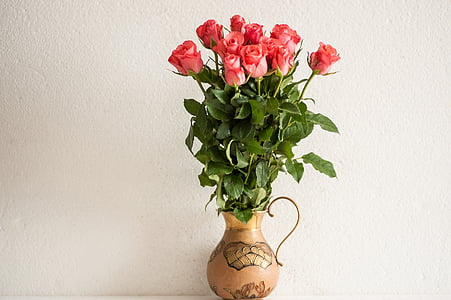 pink rose arrangement on brown vase thumbnail
