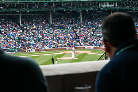 people sitting inside baseball stadium thumbnail