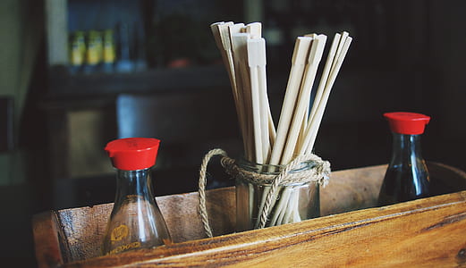 chopsticks inside clear glass holder thumbnail