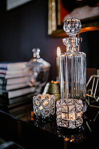 Decanter, candles, and a painting on the wall thumbnail