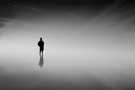 silhouette photo of man standing thumbnail