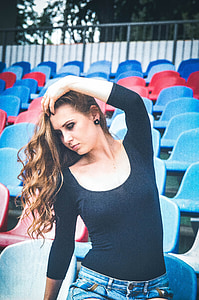 woman holding her hair in shallow focus photography thumbnail