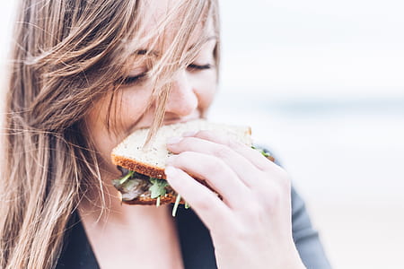 woman eating sandwich thumbnail